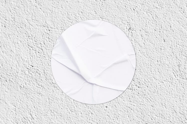 Round Sticker Mockup on Wall Texture Background
